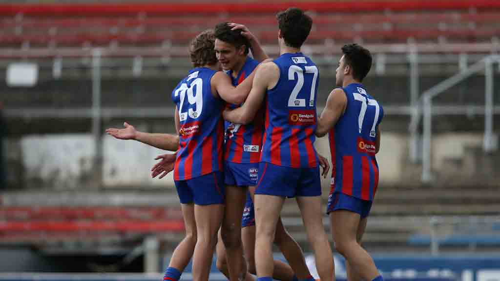 Jamarra-Ugle-Hagan-celebrates-a-goal.jpg Jamarra Ugle-Hagan is swamped by teammates after kicking a goal for the Chargers - AFL,Draft,Under-18s